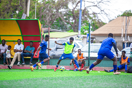 the east legon football academy field and players