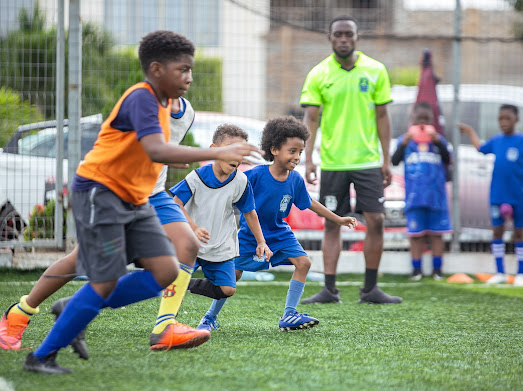 the east legon football academy field and players